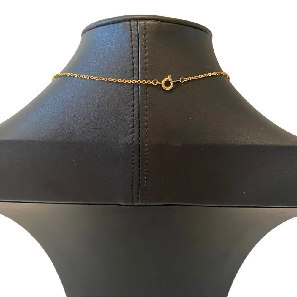 Delicate Looking Vintage Pendant on Shimmering Gold Tone Chain.